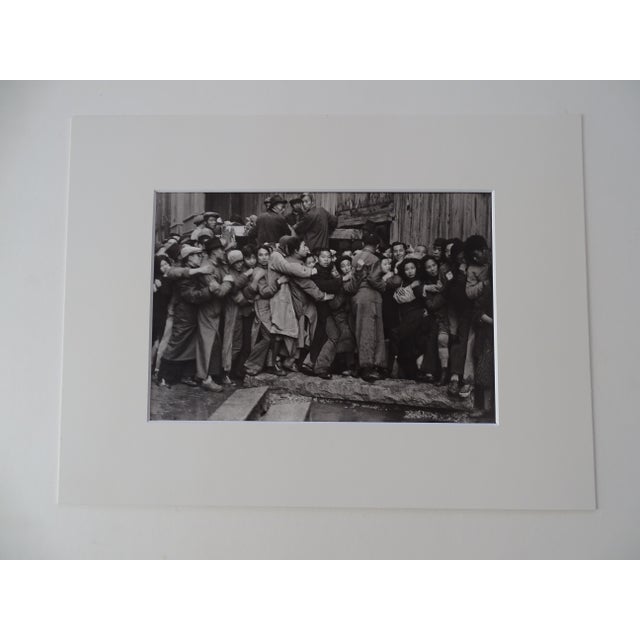 Henri Cartier-Bresson People Photolithograph, printed 1979 including the passe-partout 40x30cm picture 26 x 17 cm Bears a...