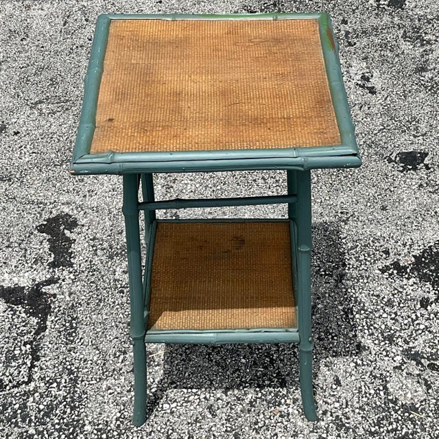 Enhance your living space with this Vintage Coastal Painted Bamboo Side Table. Embracing American style, its hand-painted...