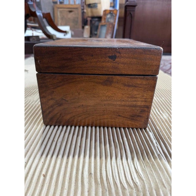 A finely crafted 19th-century Tunbridge ware box, showcasing the intricate geometric marquetry for which the style is...