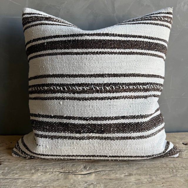 Creamy white hemp rug pillow with stripes. Soft hand, linen blend backing with zipper closure. Spot cleaning is...