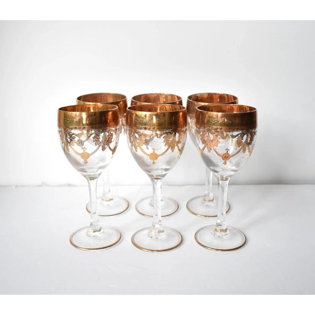 A set of 6 vintage Venetian, Italian "Medici" wine glasses from Murano with 24K gold gilt overlay designs including rococo...