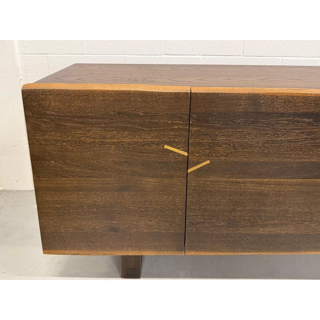 A wonderful artisan made cabinet that functions as a sideboard or credenza. Beautiful live edges on the four doors are...