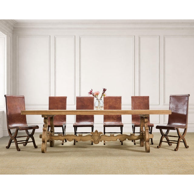 A grand 19th century trestle dining table hand-crafted out of bleached oak in a Spanish Baroque style measuring over 8.5...