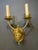A circa 1930's gilt bronze double lights hand sconces.