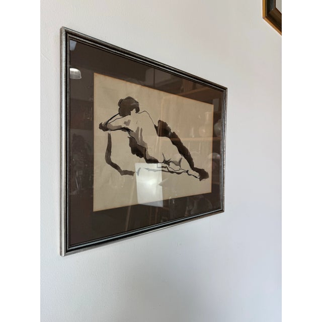 A striking and expressive 1970’s figurative watercolor painting signed by E. M. Kaufman, depicting a reclining female nude...