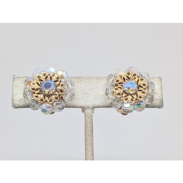 1960s goldtone round aurora borealis center with filigree surround and aurora borealis beads around the edges butterfly...