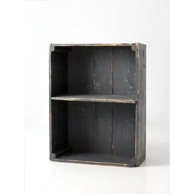 This is a vintage primitive wooden shelf. The rustic wood shelving can be mounted on the wall with back hooks or used on a...