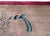 A beautiful early 20th century Chinese Art Deco rug with a gray field surrounded by a wide eggplant colored border, and...