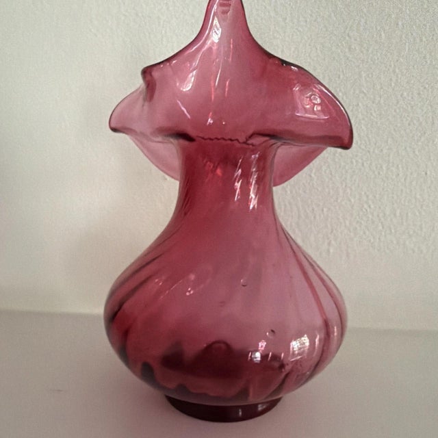 The Vintage Fenton Cranberry Jack in the Pulpit Pilgrim Art Glass vase is a stunning piece of decorative pottery featuring...
