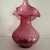 The Vintage Fenton Cranberry Jack in the Pulpit Pilgrim Art Glass vase is a stunning piece of decorative pottery featuring...