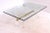This vintage coffee table, in the style of Jansen, is made of gilt brass, acrylic glass, and thick glass. It was produced...