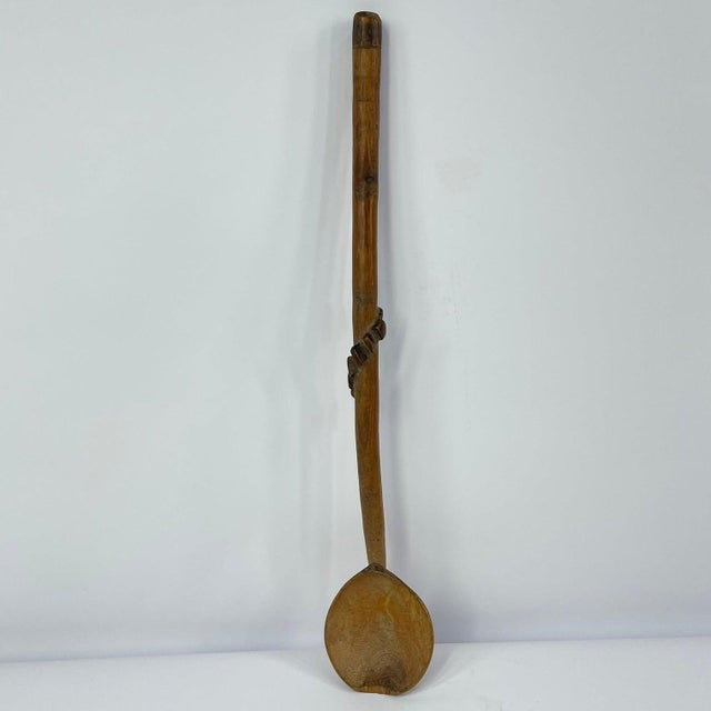 Zulu spoon from the early-mid 20th century. Natural, worn patina. Zulu spoons were carved by men only, out of a variety of...