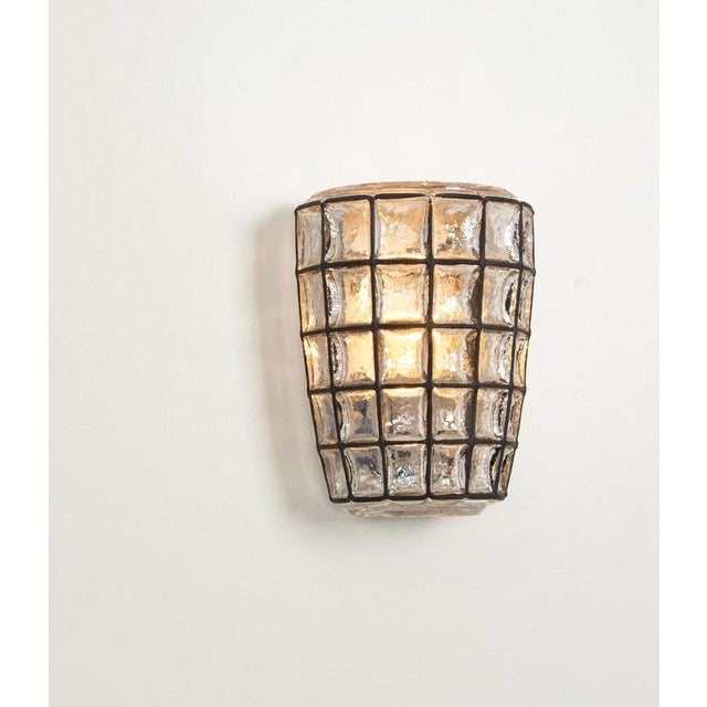 Pair of Beautiful wall lights with a unique 'iron' design by Glashütte Limburg, Germany. Manufactured in midcentury, circa...