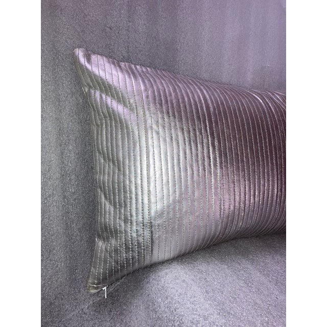 This Contemporary Silver Metallic Linear Quilted Vegan Leather Lumbar Pillow Cover adds a touch of modern style to any...