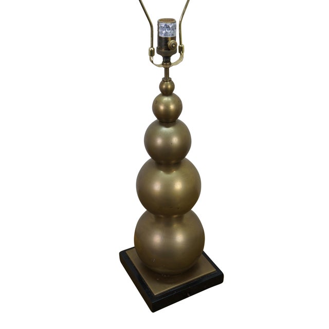 A very tall and elegant vintage Visual Comfort brass table lamp featuring a graduated / stacked ball / orb / sphere...