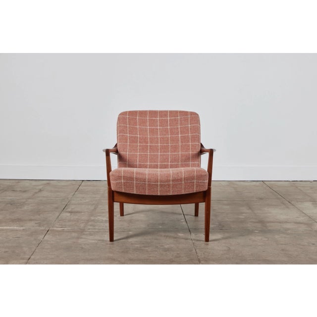 A low, Danish lounge chair by husband-and-wife design team Tove and Edvard Kindt-Larsen for France & Son. This example...