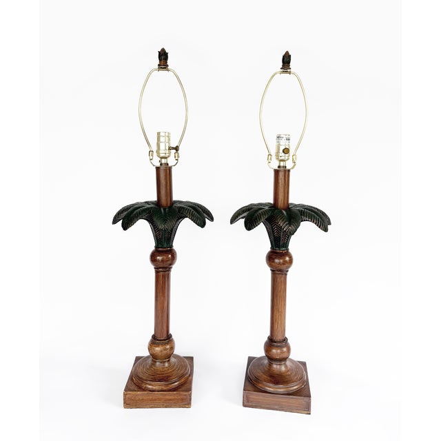 Pair of Hollywood Regency Palm Tree Table Lamps. Stylish and sturdy, these lamps feature green metal palm leaves with...