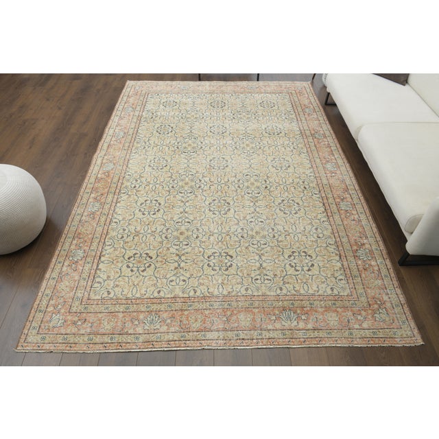 Vintage Turkish Hand-Knotted vintage rug is a semi-antique vintage area rug.'70s Eastern region of Turkey's unique rug is...