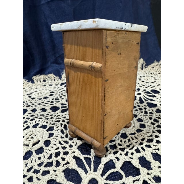 A rare and finely made French miniature chest of drawers in the faux bamboo manner, crafted in natural pine with hand-...