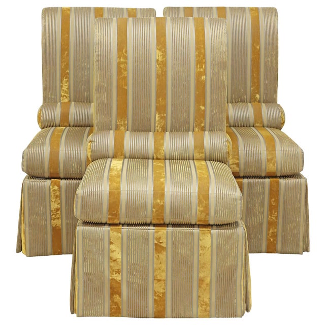 Contemporary custom chairs, 20th c., having curved back and padded seat, integral cylindrical bolster pillow, skirted...