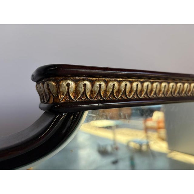 Large italian rosewood mirror with gildwood details. Original Shop sticker/manufacturer sticker still present. Very good...