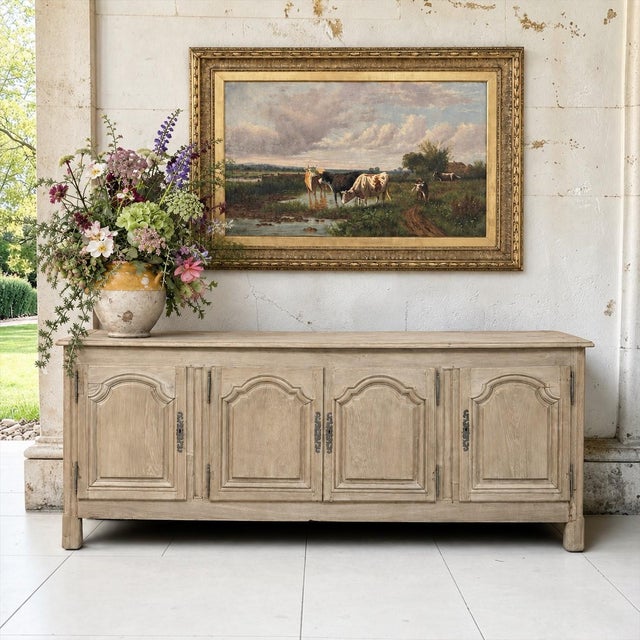 An 18th century Country French buffet in stripped white oak, designed with the simple, elegant lines of the Régence and...