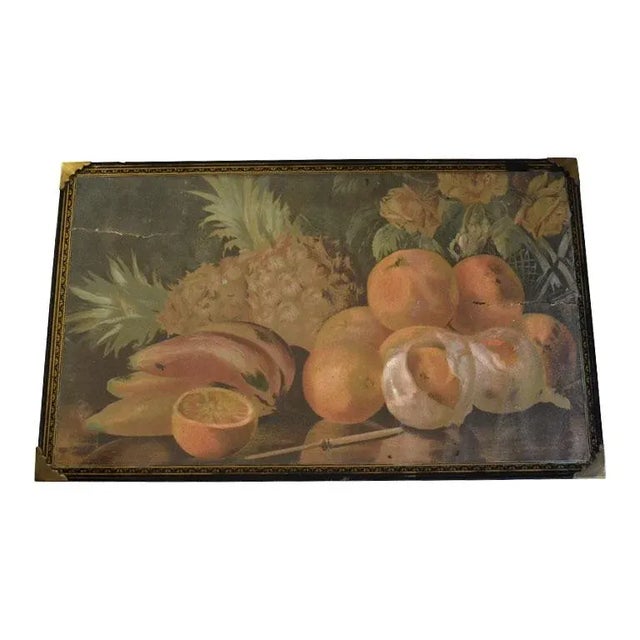 A beautiful antique still life print of fruit displayed on a table. This unique piece is created from wood, and features a...