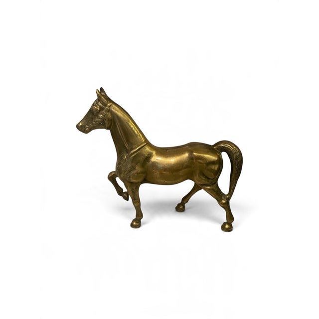 Bring a touch of classic equestrian sophistication to your space with this vintage mid-century prancing horse figurine....