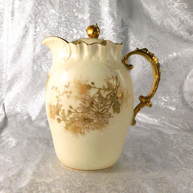 This is a cream bisque hand painted chocolate pot by Alfred Lantierenier Limgoes. It has a 1911 backstamp as shown. The...