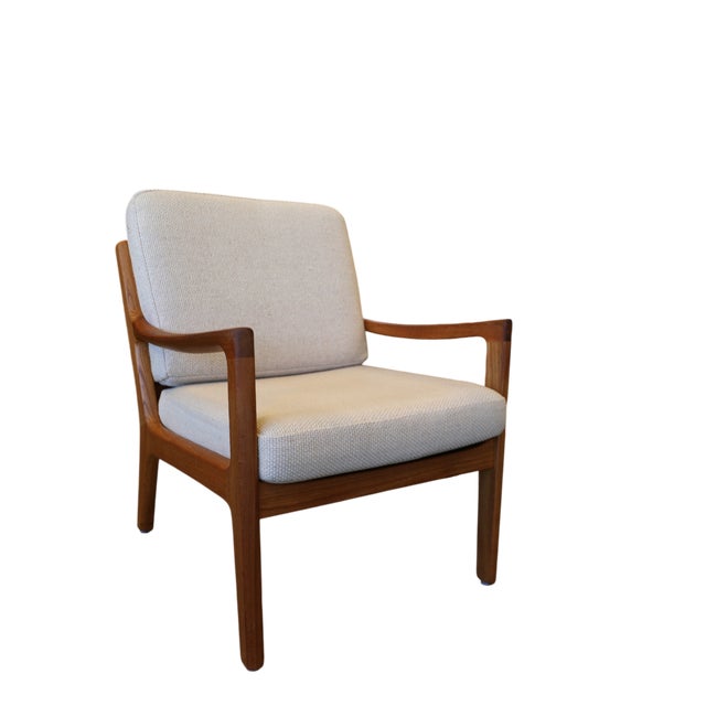 An elegant and very comfortable lounge chair in teak, model Senator, designed by Danish professor Ole Wanscher. Wanscher...