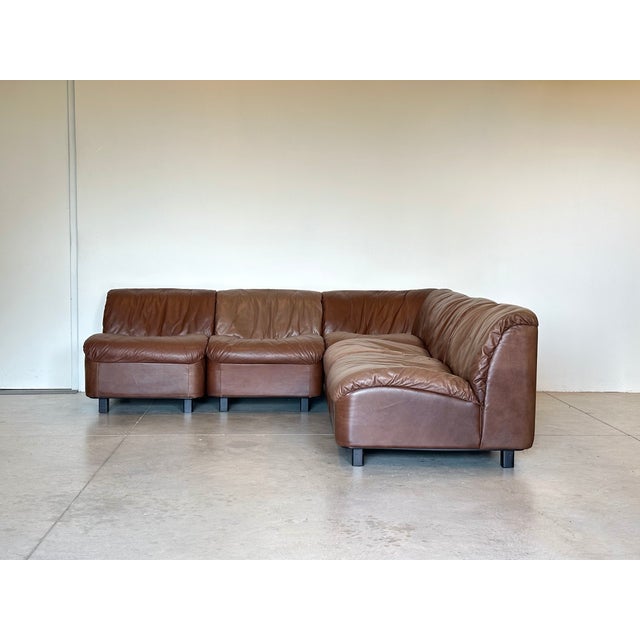 Modular leather sofa from the Deca series by Tito Agnoli for Arflex, 1970s, 5 modules (4 plus 1 corner), brown leather,...