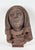 A dramatically carved 15th Century French sandstone head of a female saint. The hooded and cloaked figure looks...