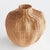 This palm rattan woven vase features an undulating shape wrapped around a rigid wire frame. It takes a masterful weaver to...
