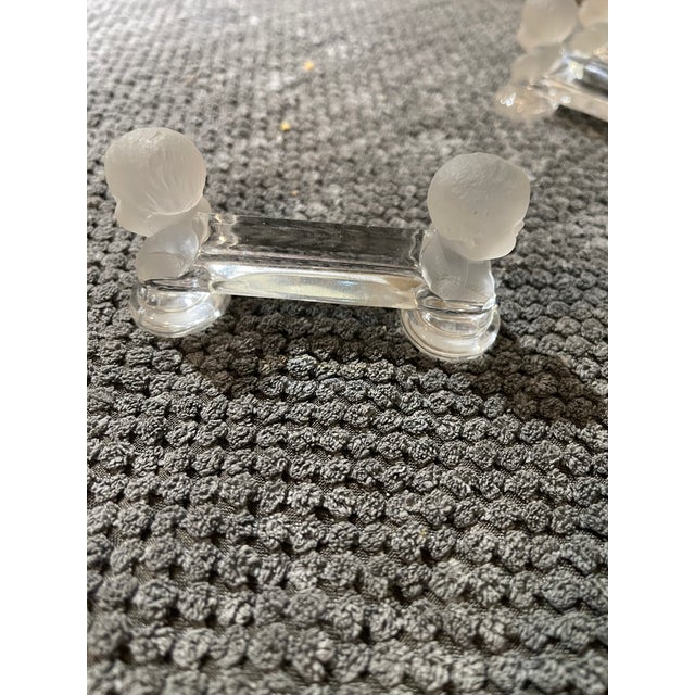 Beautiful and rare set of 8 Baccarat glass knife rests; clear and frosted. Each rest has a frosted crystal cherub on each...
