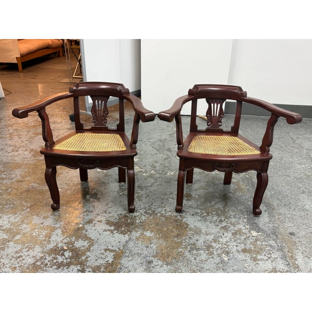 Design Plus Gallery presents a Pair of Lyre Back Arm Chairs in the French Anglo-Indian Style. The chairs offer an auburn...