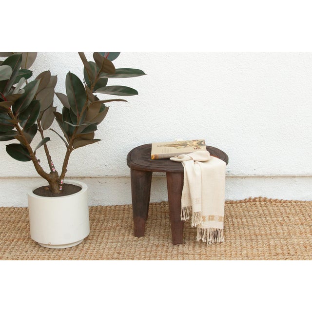 A unique piece of African art, this vintage Nupe table from Nigeria is a must-have for collectors and enthusiasts of Nupe...