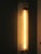 This Art Deco wall light was produced in France in the 1930s. The frosted glass half-cylinder is fixed to the underside of...