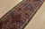 An authentic vintage tribal Hamedan runner hand-knotted with fine wool and natural dyes. This nomadic rug features a row...