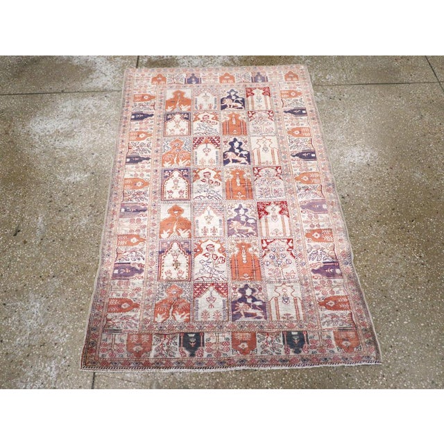 This mid-20th century Turkish Kayseri rug, features a distinctive garden panel design composed of individually framed...