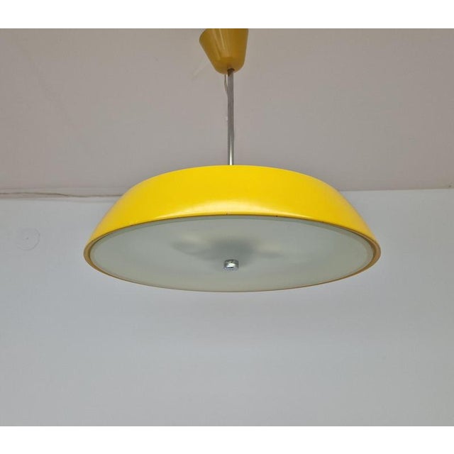 Very nice style of lighting - rare in yellow. This piece is attributed to the mentioned designer/maker. It has no...