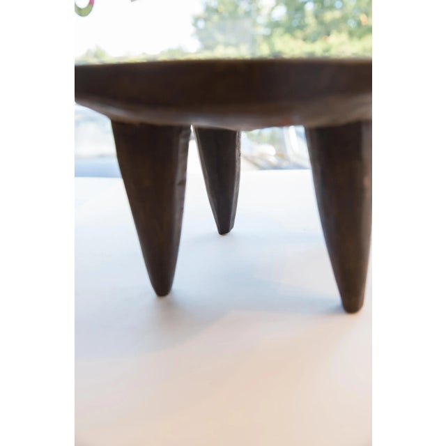 :: Vintage handmade African Senufo wood milk stool. Circa 1970s, this wooden stool was hand carved by the Senufo people in...