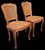 Elegant pair of Italian Louis XV style side chairs, crafted in walnut and retaining their original hand-woven cane seats...