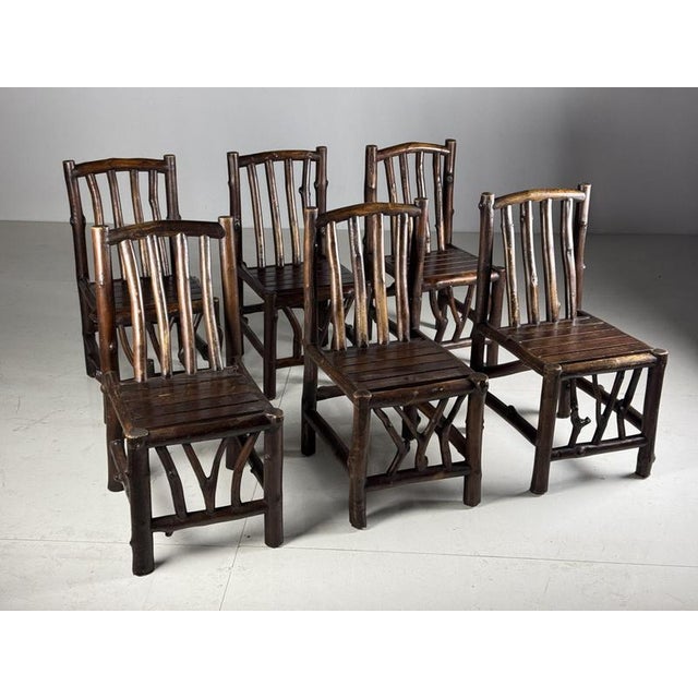 Set of 6 unique dining room chairs made of hardwood trunks. Each chair is extremely heavy and very solid. Would also be...