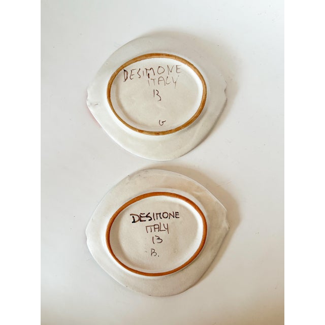 The most charming and whimsical pair of DeSimone terra cotta fish plates, hand painted by the famed Italian studio known...