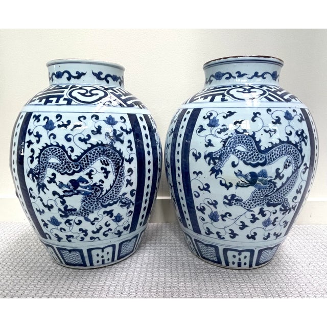 This is an impressive set. They are beautifully hand painted and glazed. There are soft flaws and smooth scars in both...