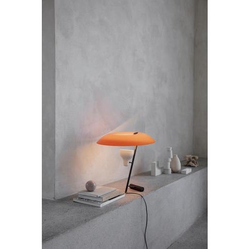 Model 548 design by gino sarfatti the table lamp designed in 1951 is a study in balance and light reflection through a...