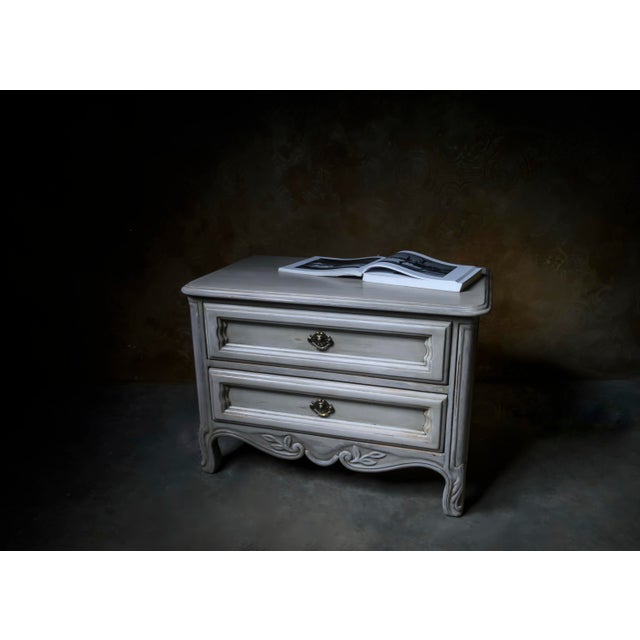 A pair of original Drexel French Provincial nightstands, dated 1966, fitted with vintage hardware selected for a more...
