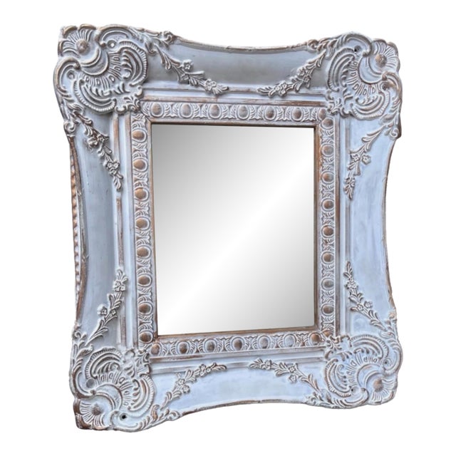 French Country Wall Mirror Features a Heavily Distressed White Frame With Gold Trim For Sale