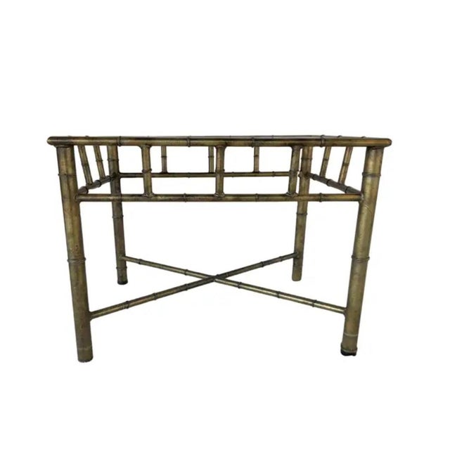 French Faux Bamboo Brass Side Table with Glass Top. Table features a classic faux bamboo frame in patinated brass,...