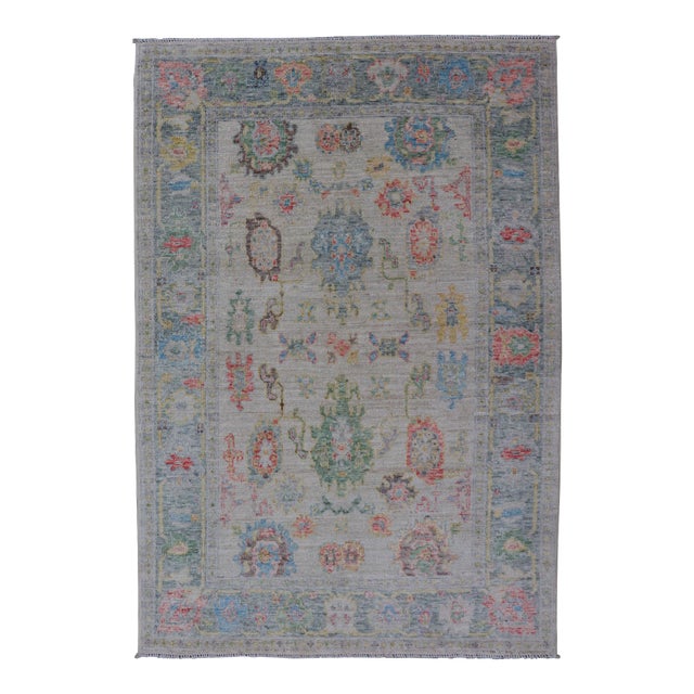 Modern All-Over Floral Oushak With Muted Background and Accent Colors For Sale